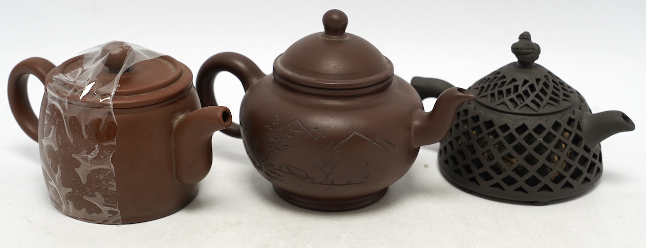 Three Yixing teapots, one double walled lattice worked body, tallest 11cm. Condition - good